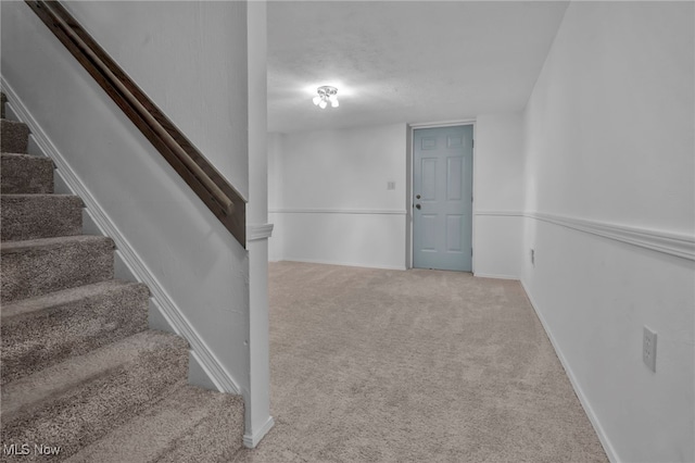 stairs with carpet and baseboards