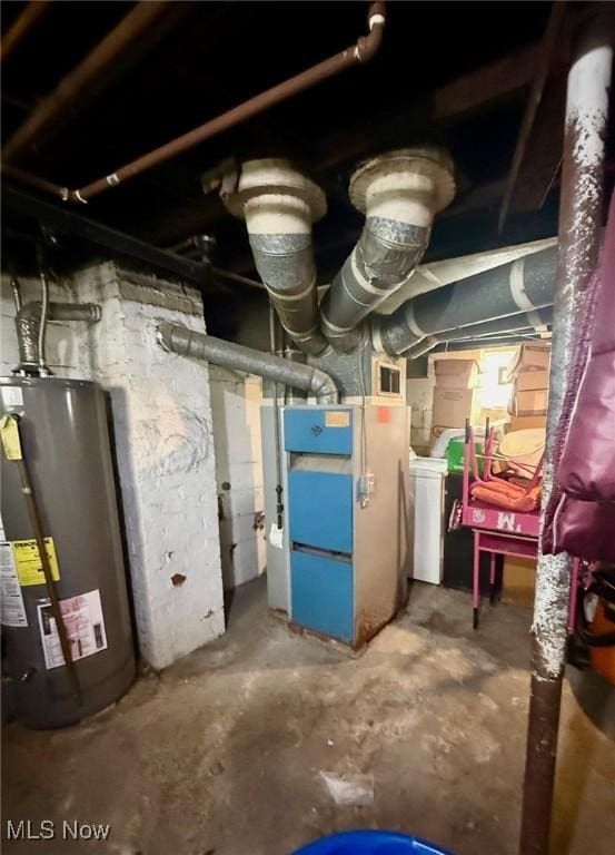 utility room featuring gas water heater
