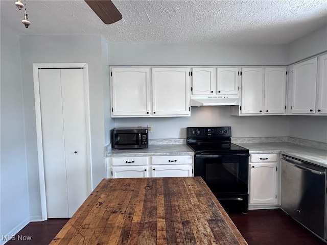 kitchen featuring stainless steel appliances, white cabinetry, and wooden counters