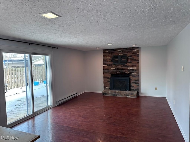 unfurnished living room with dark wood-style floors, a baseboard radiator, baseboards, and a brick fireplace