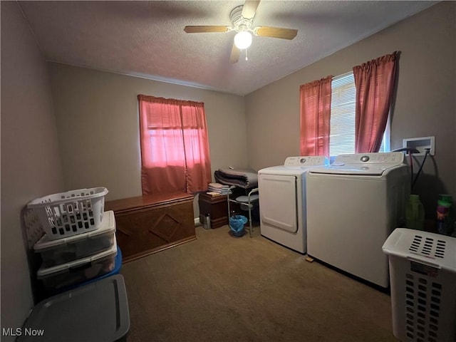 clothes washing area featuring a ceiling fan, carpet flooring, a textured ceiling, laundry area, and independent washer and dryer