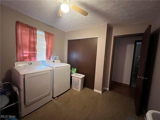 washroom with carpet, washing machine and dryer, ceiling fan, a textured ceiling, and laundry area