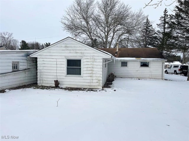 view of snow covered property