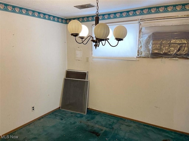 unfurnished dining area with visible vents, a notable chandelier, and baseboards