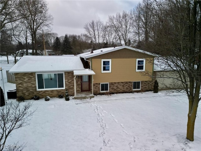 split level home with brick siding