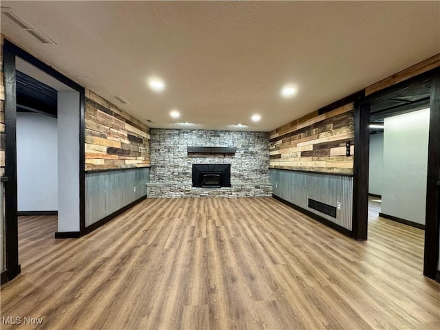 unfurnished living room featuring recessed lighting, visible vents, and wood finished floors