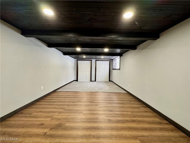 finished basement with light wood finished floors, baseboards, and recessed lighting