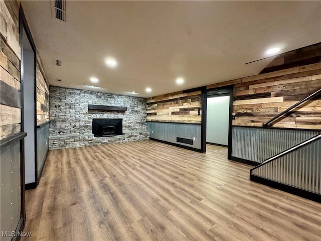 unfurnished living room with light wood-type flooring, visible vents, and recessed lighting