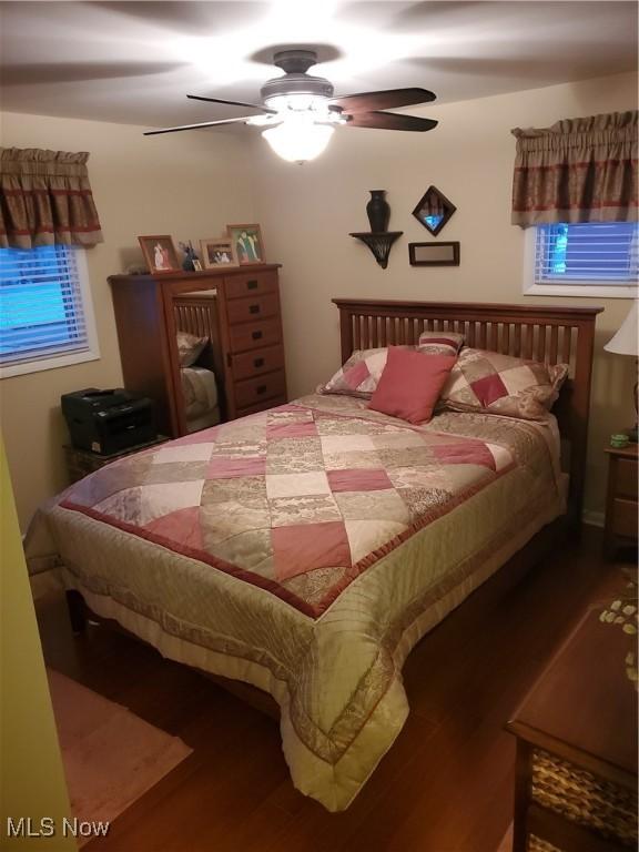 bedroom featuring a ceiling fan and wood finished floors