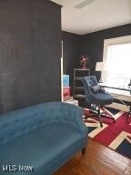 bedroom featuring dark wood finished floors