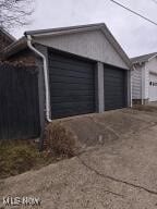 garage featuring driveway