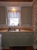 kitchen featuring light countertops and a sink