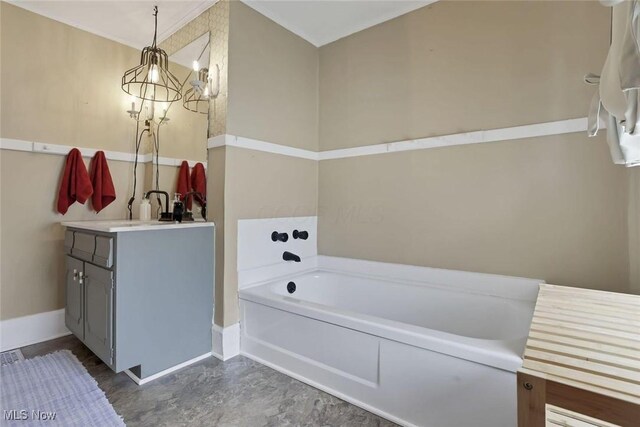 1304 Foster Ave, Cambridge, OH 43725 - bathroom with a garden tub, vanity, and baseboards