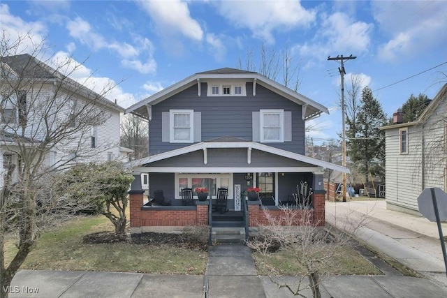 1304 Foster Ave, Cambridge, OH 43725 - american foursquare style home with a porch and brick siding