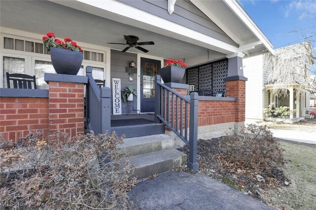 1304 Foster Ave, Cambridge, OH 43725 - property entrance with a porch, a ceiling fan, and brick siding