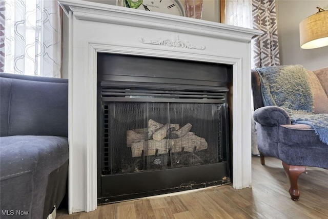 1304 Foster Ave, Cambridge, OH 43725 - details featuring a fireplace and wood finished floors