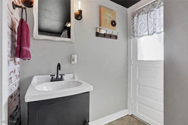 1304 Foster Ave, Cambridge, OH 43725 - bathroom featuring vanity and baseboards