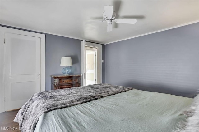 1304 Foster Ave, Cambridge, OH 43725 - bedroom featuring ceiling fan, dark wood finished floors, and crown molding