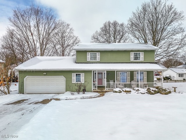 view of front of home with a porch and an attached garage