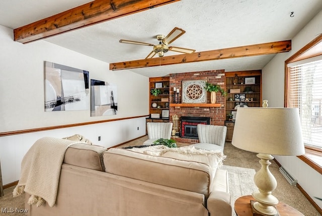 living area with carpet floors, a brick fireplace, beam ceiling, and a textured ceiling