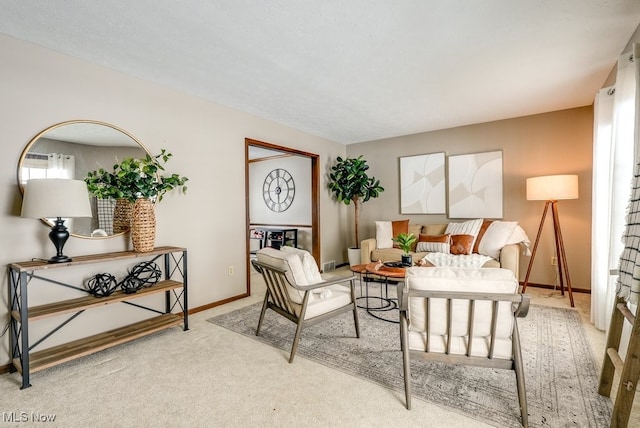 living room with baseboards and light colored carpet