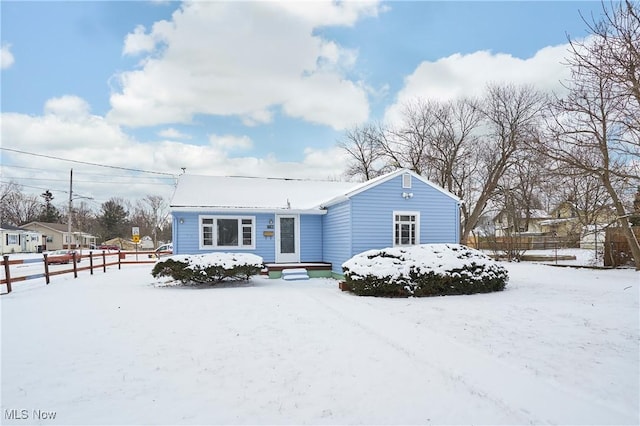 view of front of property featuring fence