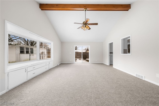 unfurnished living room with high vaulted ceiling, visible vents, beamed ceiling, and light carpet