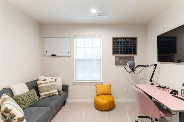 office with light carpet, visible vents, and baseboards