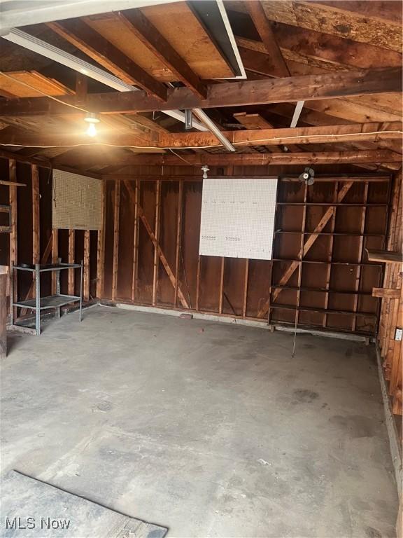 miscellaneous room featuring a garage and concrete floors