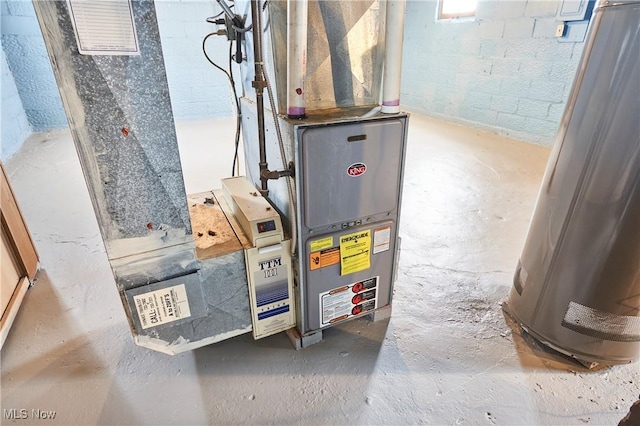 utility room featuring water heater