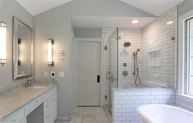 full bathroom featuring marble finish floor, a shower stall, vaulted ceiling, and vanity