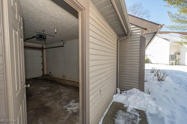 exterior space with a garage door opener