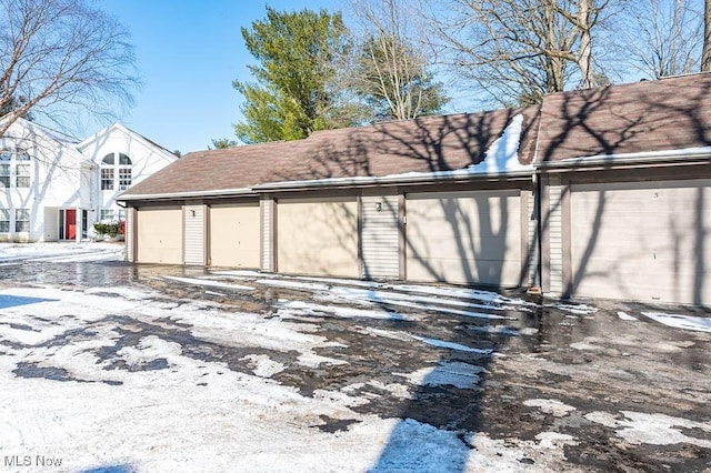 view of snow covered garage