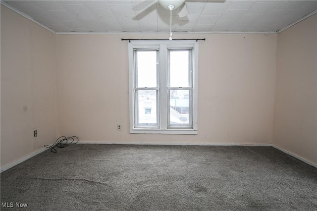 spare room with ceiling fan, baseboards, and carpet flooring