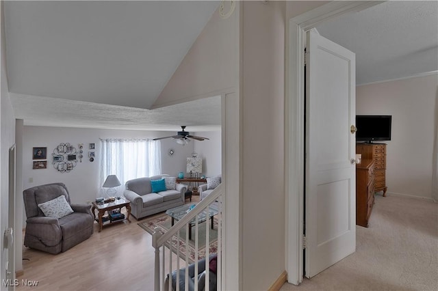 living room featuring a textured ceiling and baseboards