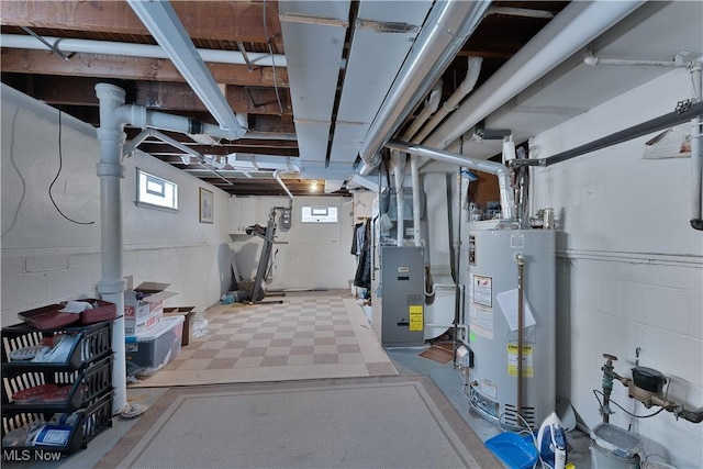 below grade area featuring heating unit and gas water heater