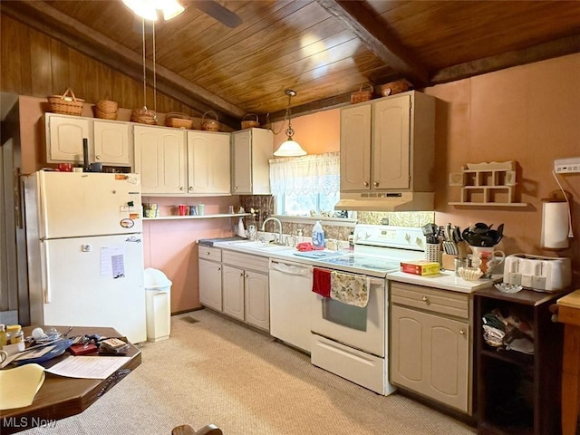 kitchen with pendant lighting, light countertops, a sink, white appliances, and under cabinet range hood