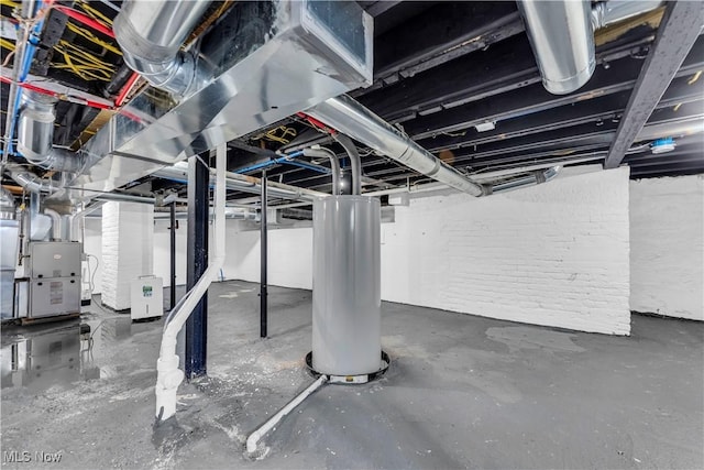 unfinished basement featuring heating unit and gas water heater