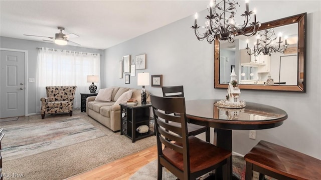 dining room with a ceiling fan and wood finished floors