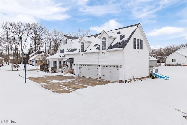 view of front of property with a garage and a residential view