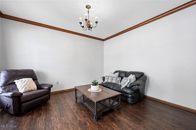 living room with ornamental molding, a chandelier, dark wood-type flooring, and baseboards