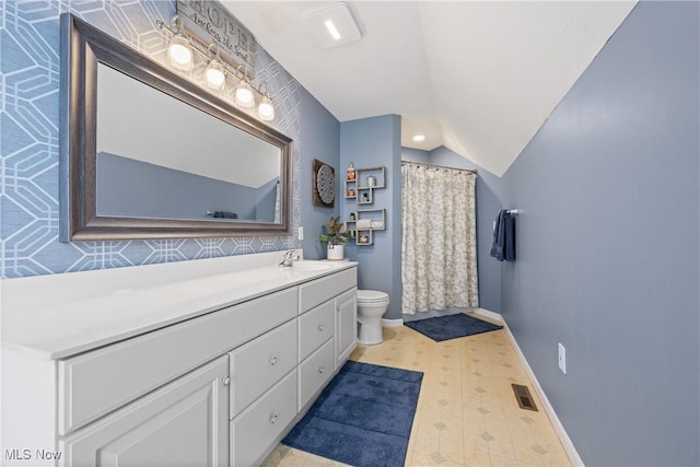 full bathroom featuring baseboards, visible vents, lofted ceiling, toilet, and tile patterned floors