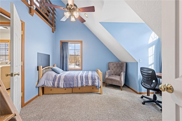 carpeted bedroom with lofted ceiling, multiple windows, washer / dryer, and baseboards