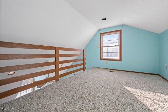 bonus room with carpet, vaulted ceiling, and baseboards