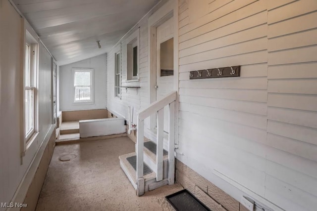 staircase with vaulted ceiling