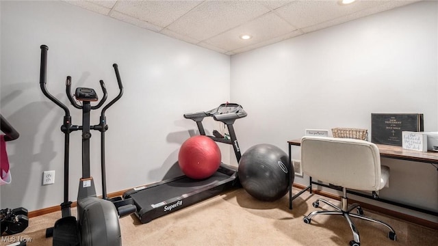 exercise area with recessed lighting, a drop ceiling, carpet flooring, and baseboards