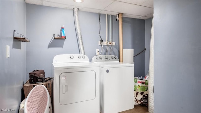 laundry room with washing machine and clothes dryer