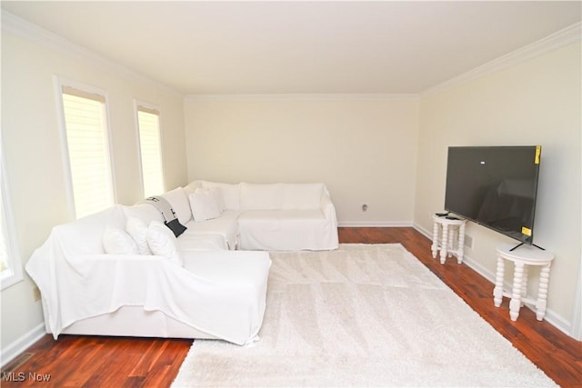 living area featuring dark wood-style floors, baseboards, and ornamental molding