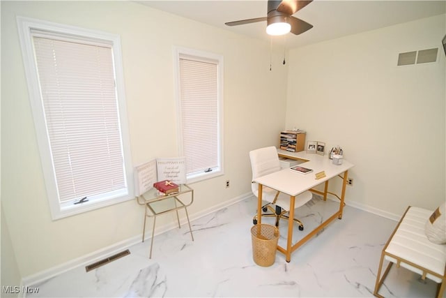 home office with marble finish floor, a ceiling fan, visible vents, and baseboards