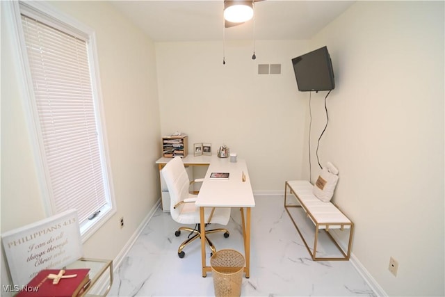 office featuring marble finish floor, visible vents, and baseboards